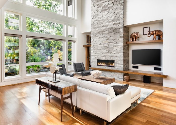 Beautiful,Living,Room,Interior,With,Hardwood,Floors,And,Roaring,Fire