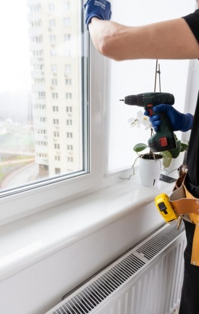 Handsome,Young,Man,Installing,Bay,Window,In,A,New,House